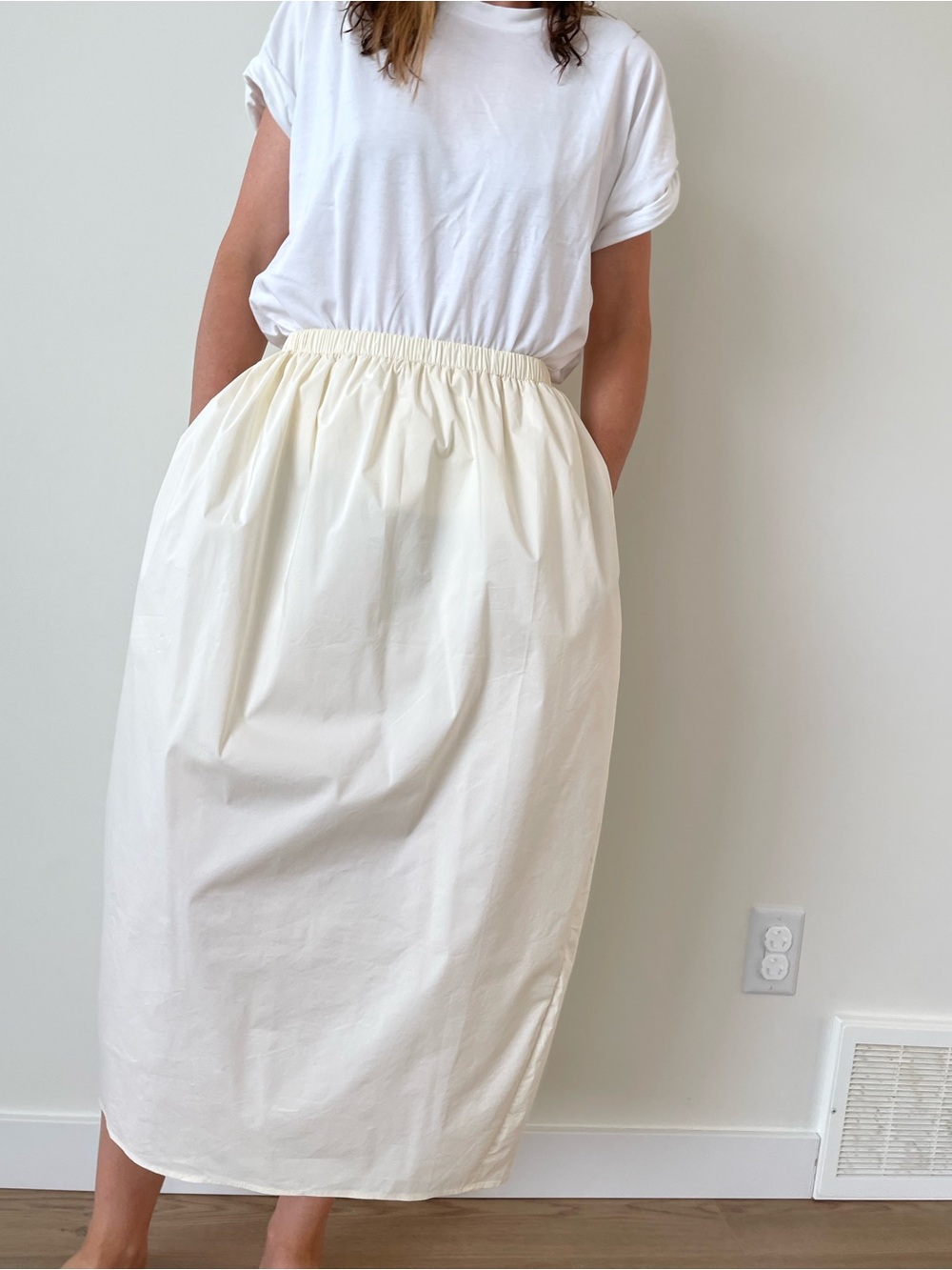 Parachute skirt with uneven hem in cream